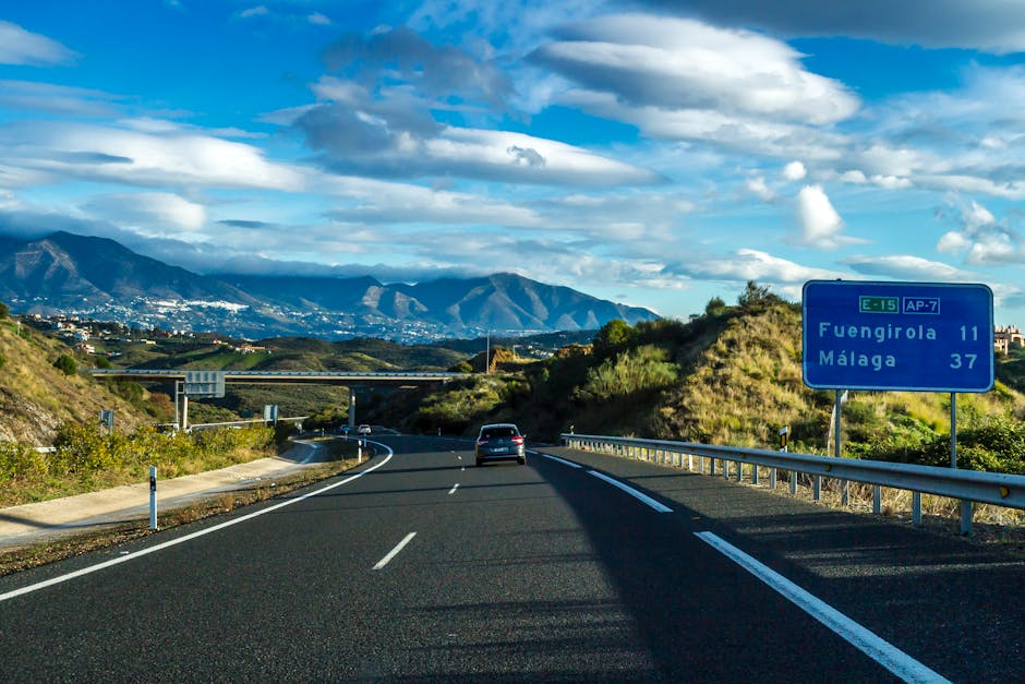 Beautiful view of AP-7 highway near Fuengirola and Málaga, with distant mountains under a blue sky.